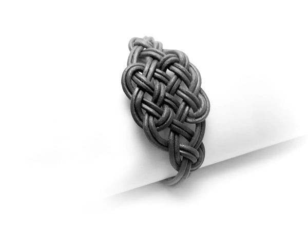 Pulsera de cuero trenzado con nudo celta